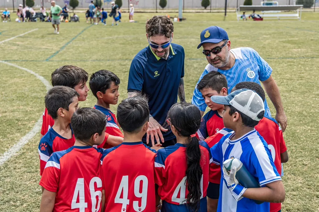 Coaches in a pre-match huddle with the squad