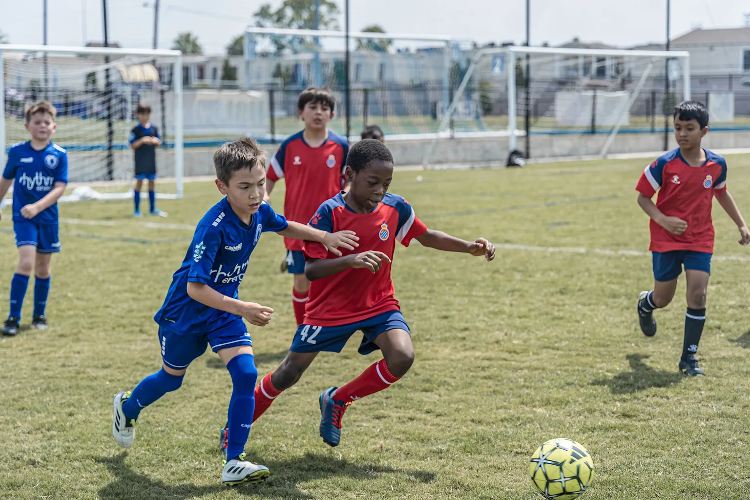 Players sprinting for possession in match