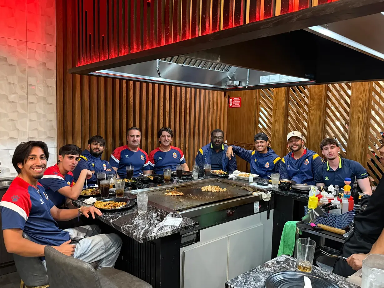 RCDE Academy Texas coaching staff sharing a hibachi dinner together