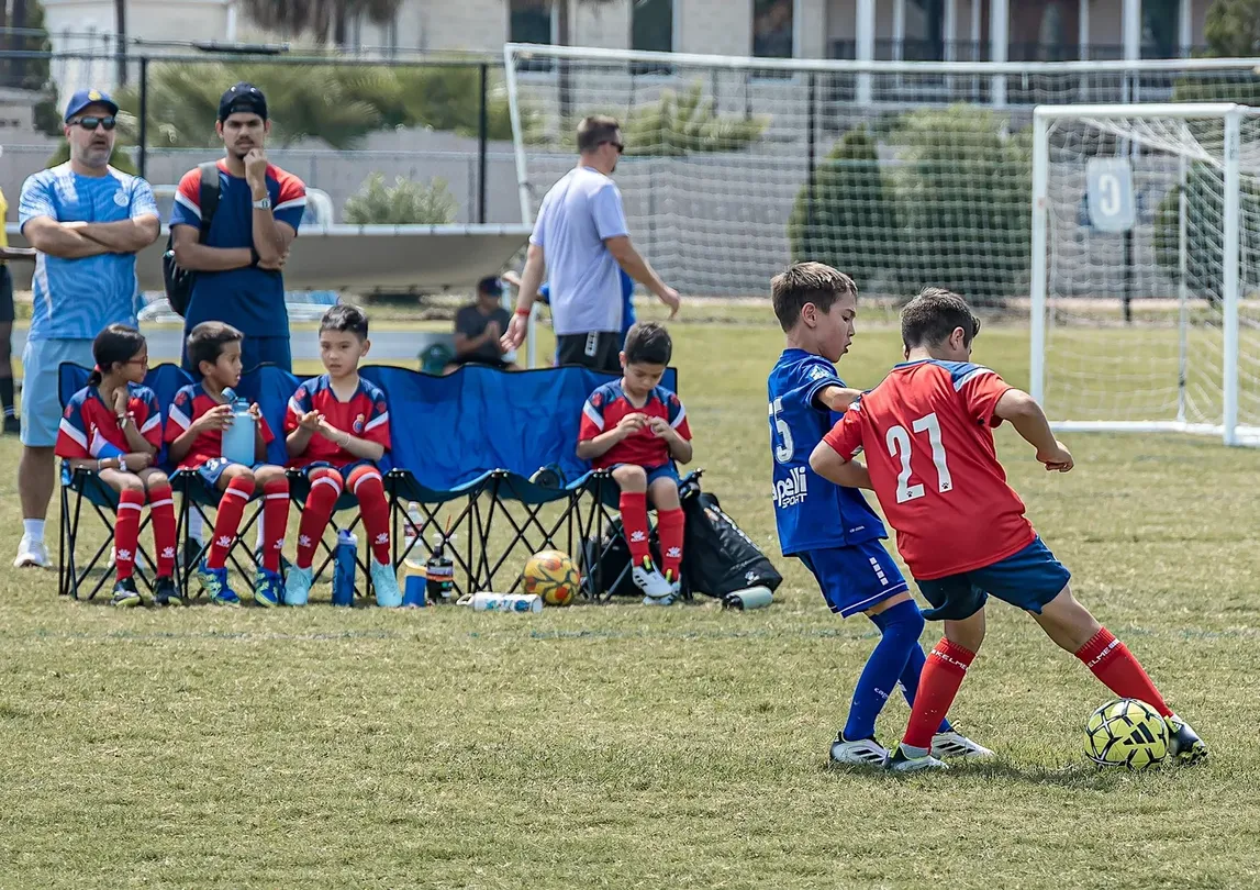 Two players battling for the ball in a competitive match