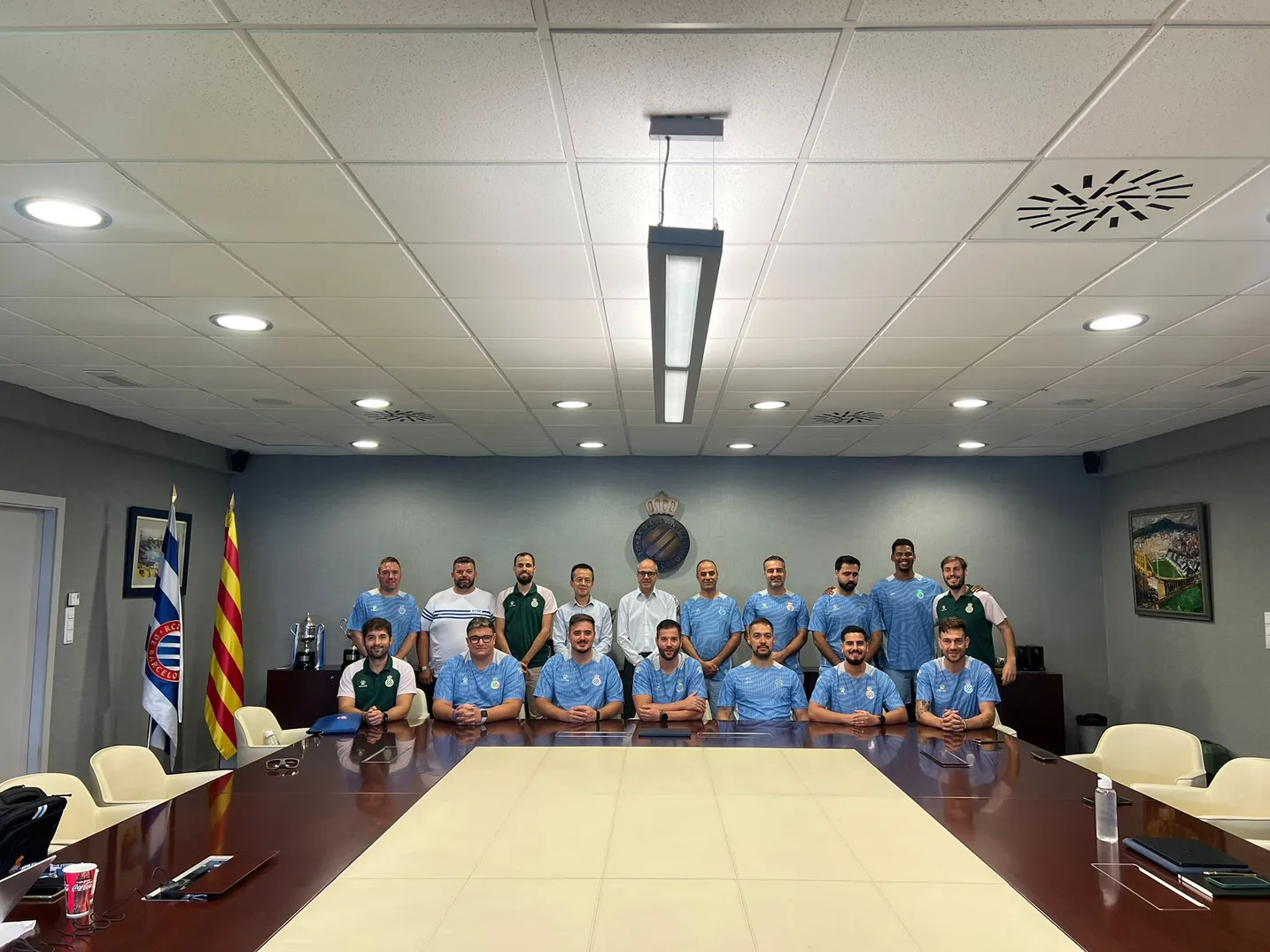 RCDE Academy Texas coaching staff with RCD Espanyol directors inside the boardroom at the club headquarters in Barcelona